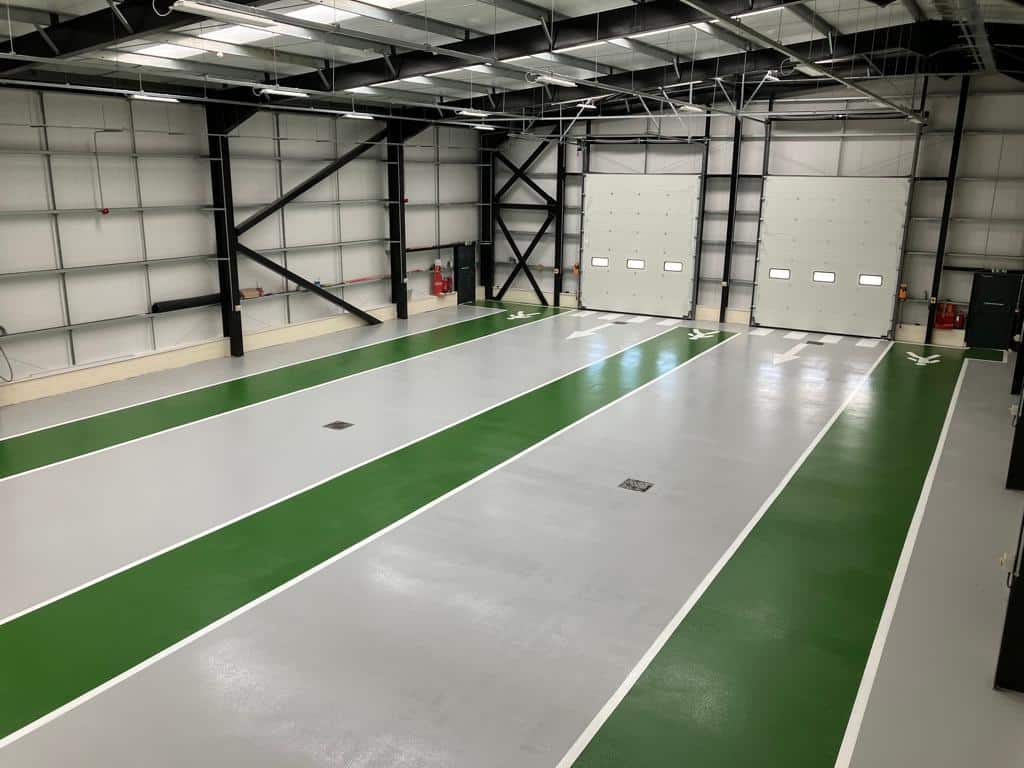 resin flooring contractor monarch installed resin at vehicle storage warehouse resin flooring hull green gangways grey resin white line marking