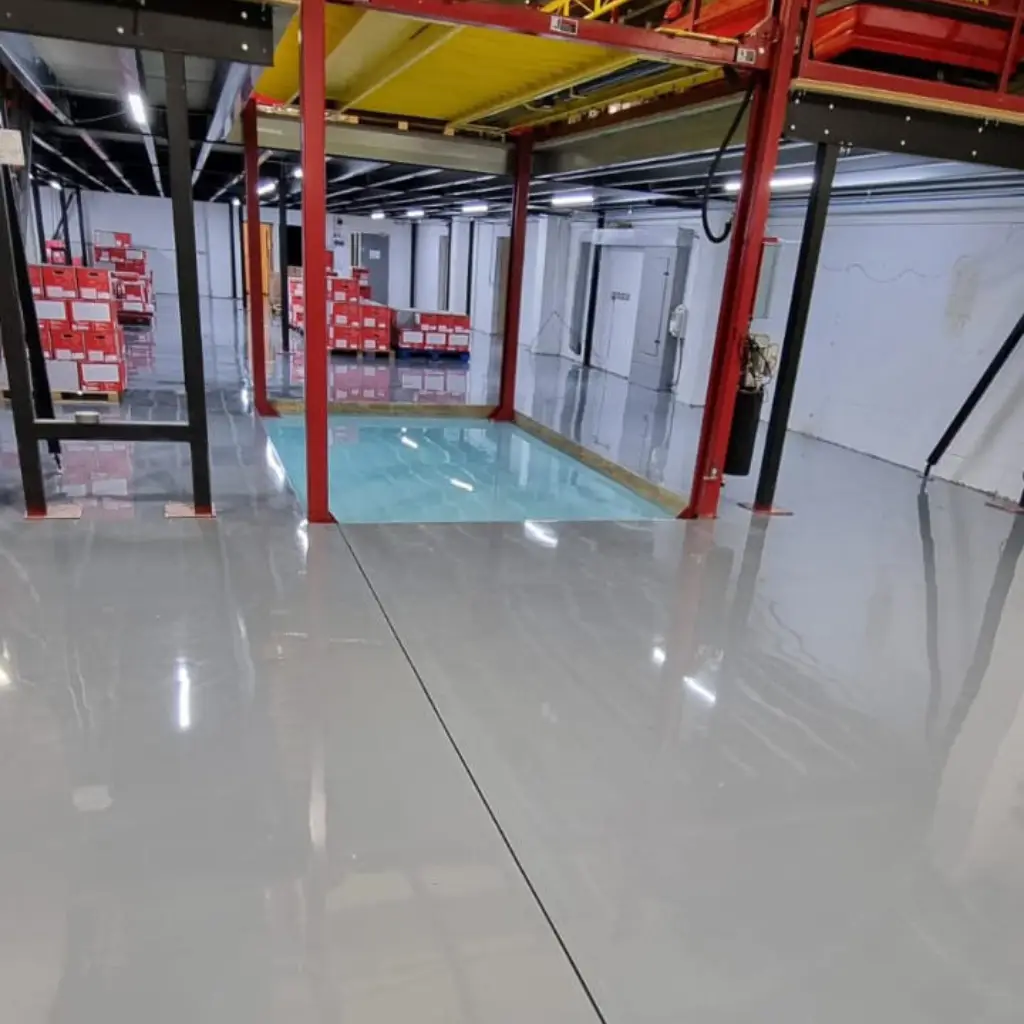 resin floor in workshop using Monarflow and Monarcoat 700 resin line paint - stencil work